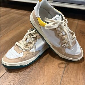 Stylish White and Tan Sneakers with Yellow Accent